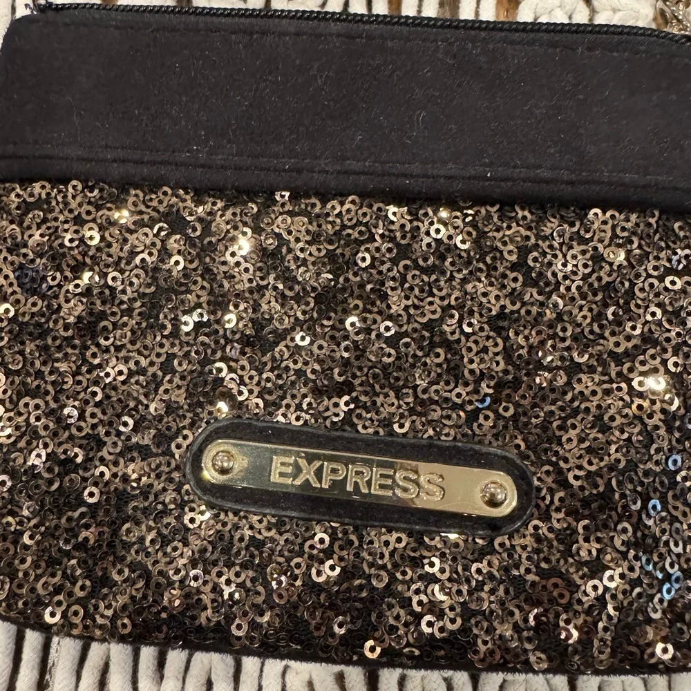 Express black sequin wristlet.